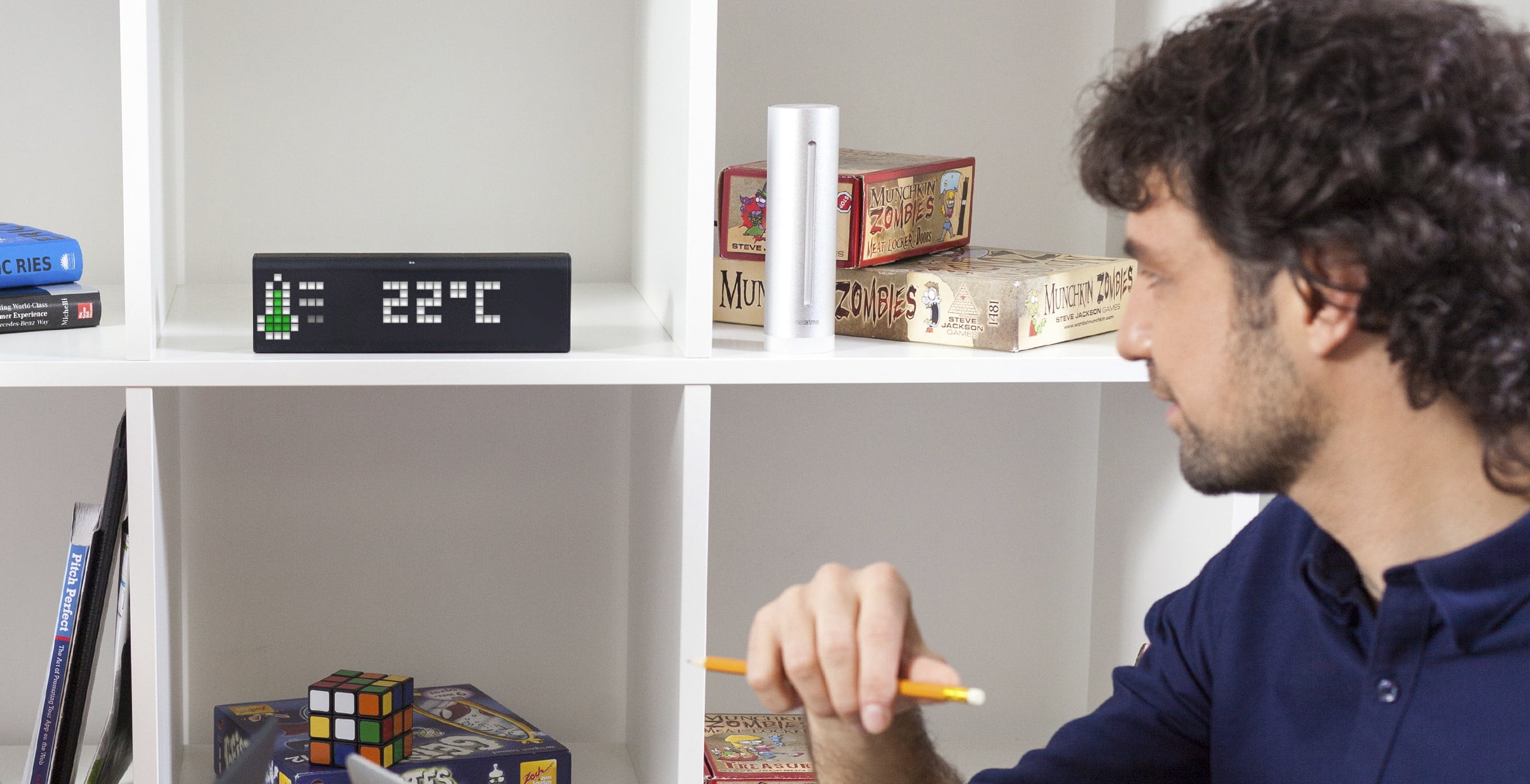 Smart clock, which is located on a shelf in the meeting room, shows the indoor temperature from Netatmo weather station 